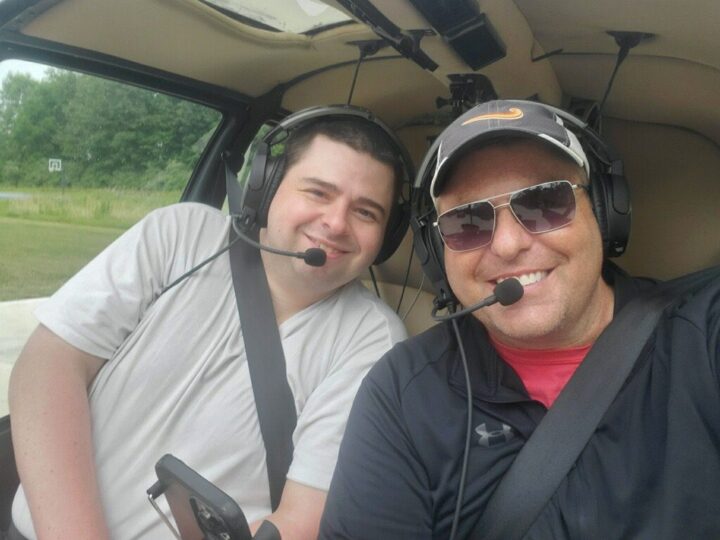 Adrian learning about aviation with a pilot instructor