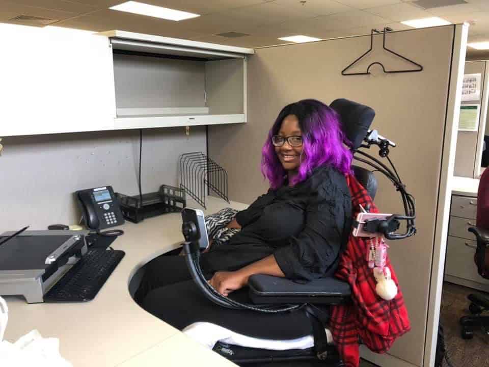 Markesha using assistive technologies to work in an office