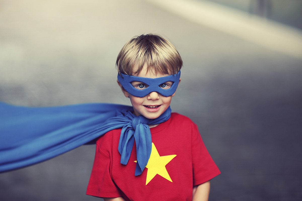 Kid in a generic superhero costume